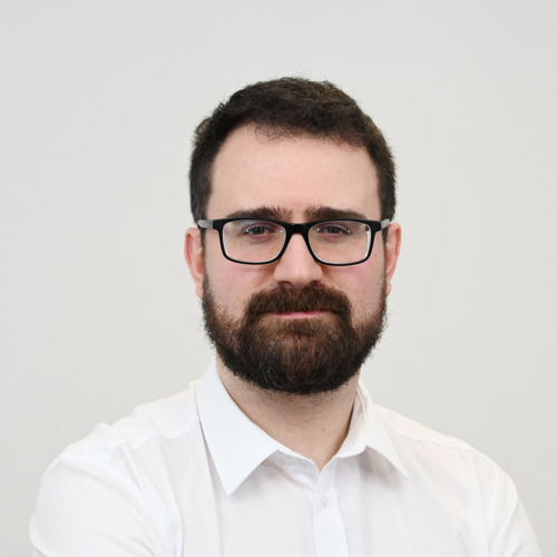 A portrait photo of Alistair Hill